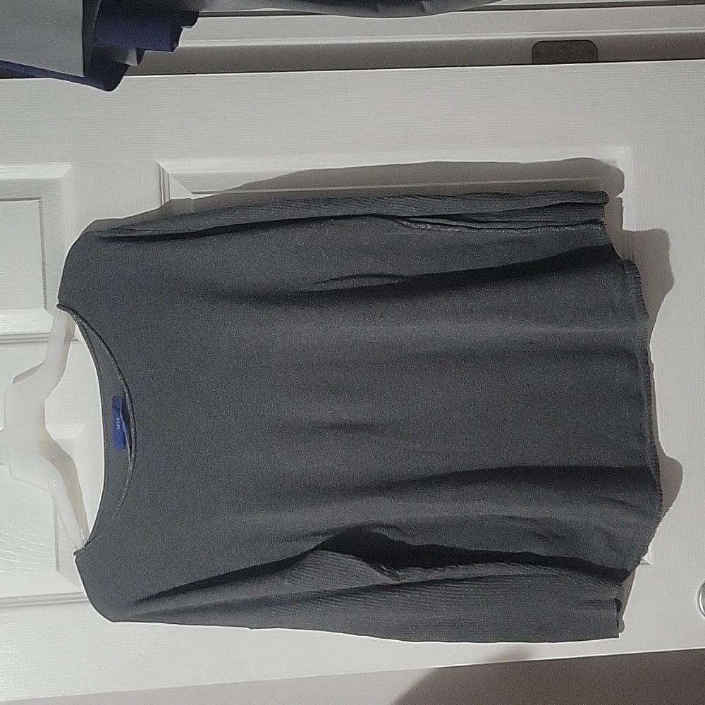 Gray sweater with silver thread edging on neck and side seams rib knit arms